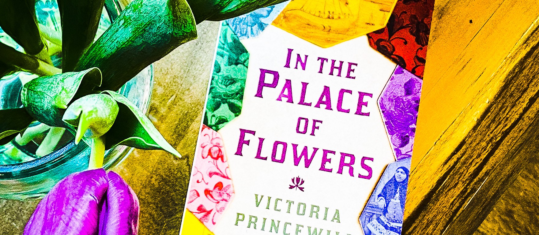 In The Palace Of Flowers book next to flowers